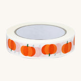 Babipur Pumpkin Eco Paper Tape in white, with orange pumpkin repeat pattern. On a cream background