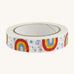 Paper tape with rainbows and stars on a cream background.