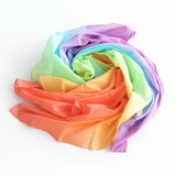 A pastel rainbow Laura's play cloth in a swirl pattern