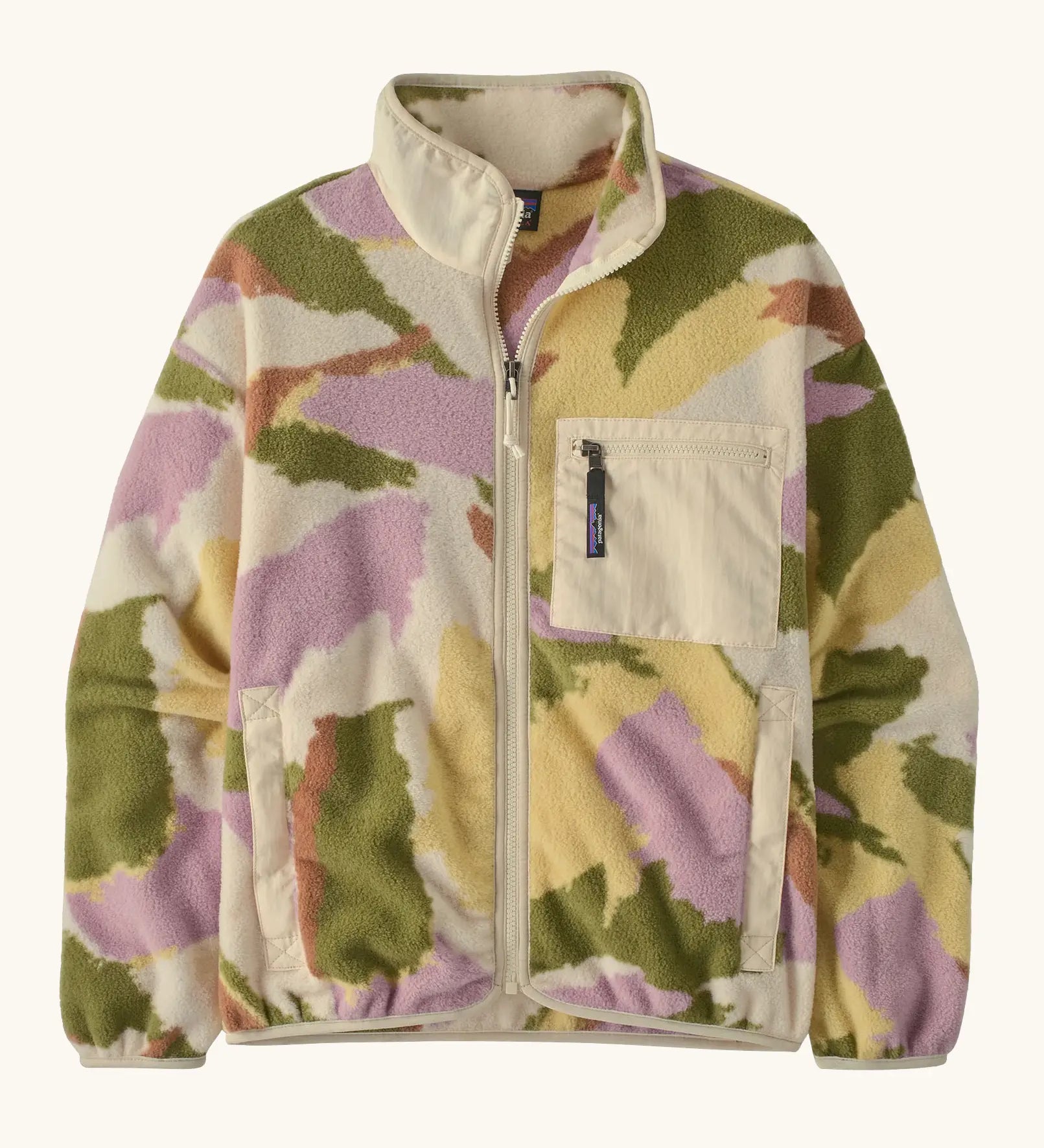 Patagonia women's synchilla fleece jacket in cream with a repeating abstract pattern. Shows a front zip, side and chest pocket