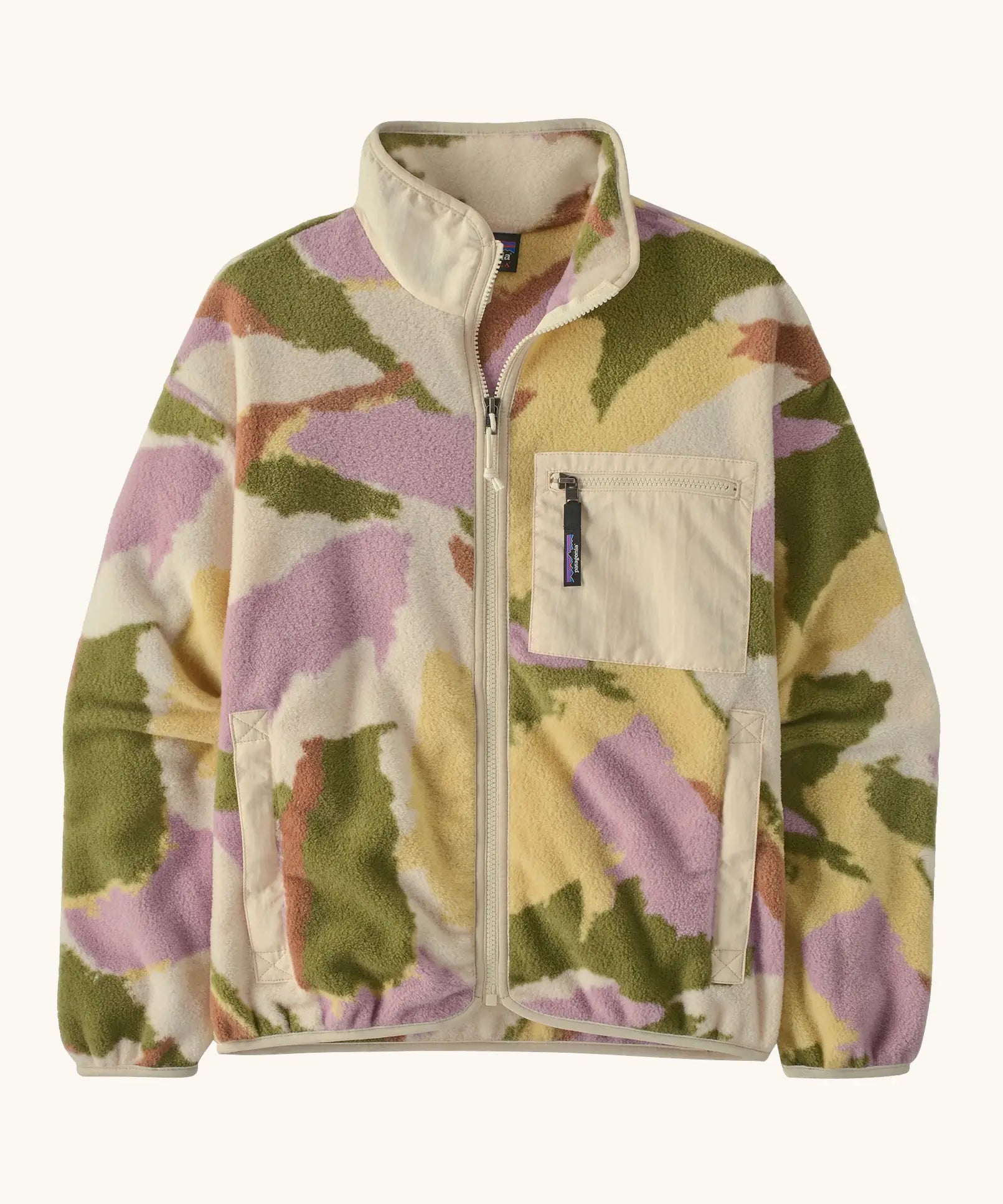 Patagonia women's synchilla fleece jacket in cream with a repeating abstract pattern. Shows a front zip, side and chest pocket