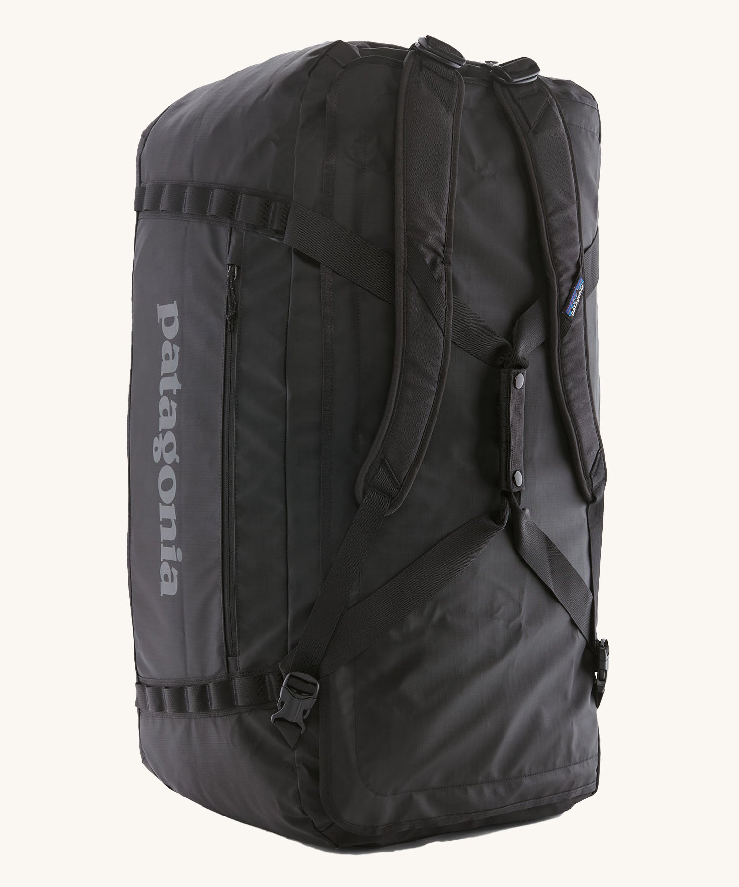 The Patagonia Black Hole Duffel 100L Black upright showing the shoulder straps and carry handles