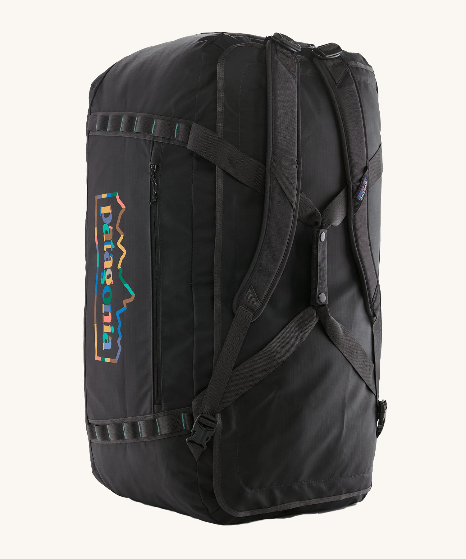 The Patagonia Black Hole Duffel 100L Ink Black upright showing the shoulder straps and carry handle