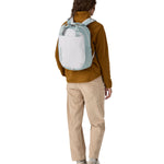 A person wearing the Patagonia Atom Tote Pack 20L Crisp Grey on their back