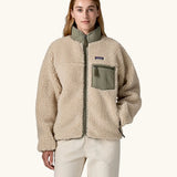 Woman wearing Patagonia Women's Classic Retro-X® Fleece Jacket in Dark Natural w/River Rock Green. Fully zipped. 