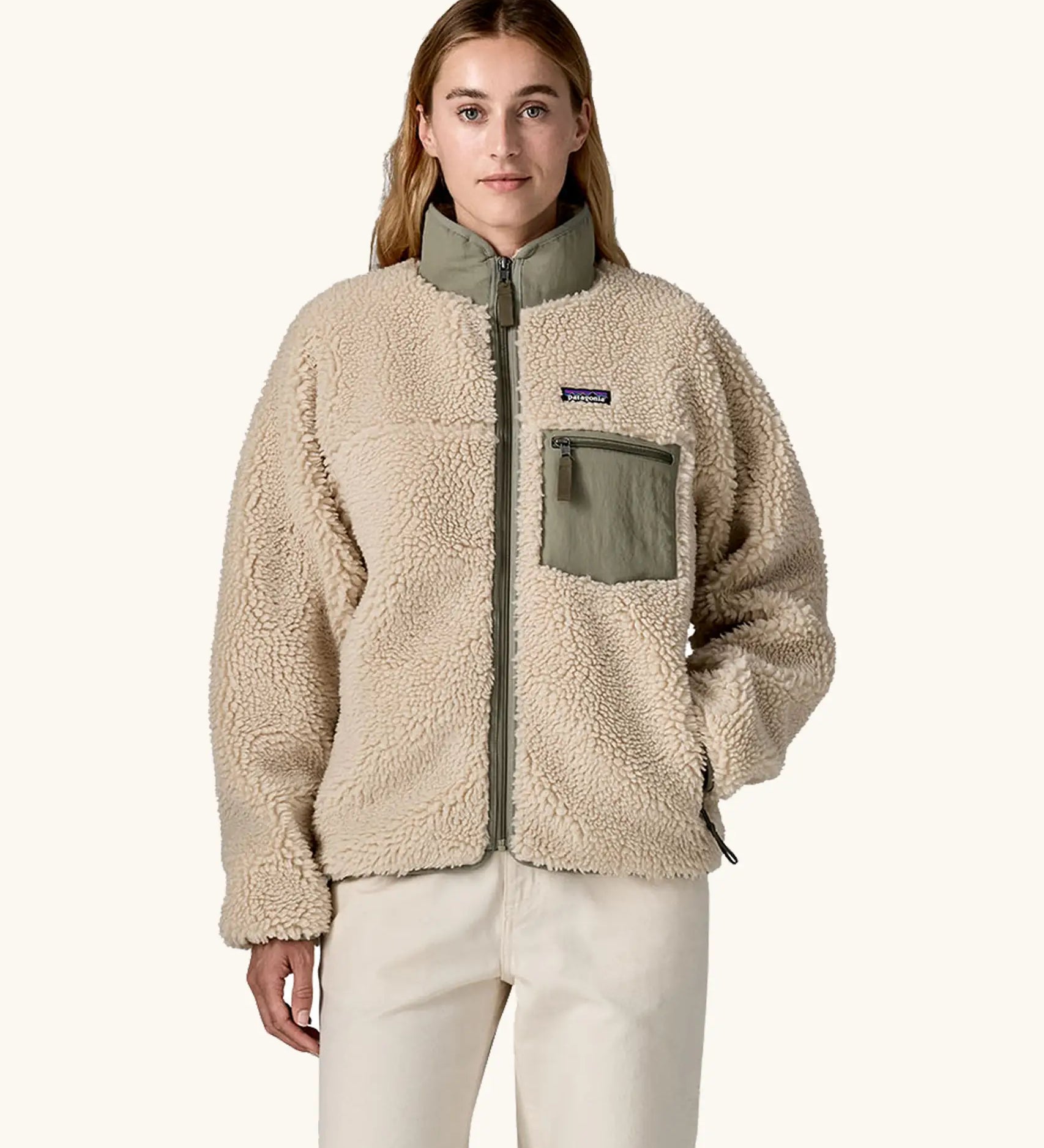 Woman wearing Patagonia Women's Classic Retro-X® Fleece Jacket in Dark Natural w/River Rock Green. Fully zipped. 
