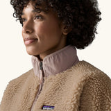 Close up of collar, zip and patagonia logo on Patagonia Women's Classic Retro-X® Fleece Jacket in oar tan.
