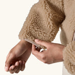 close up of sleeve, tan binding on Patagonia Women's Classic Retro-X® Fleece Jacket in oar tan.