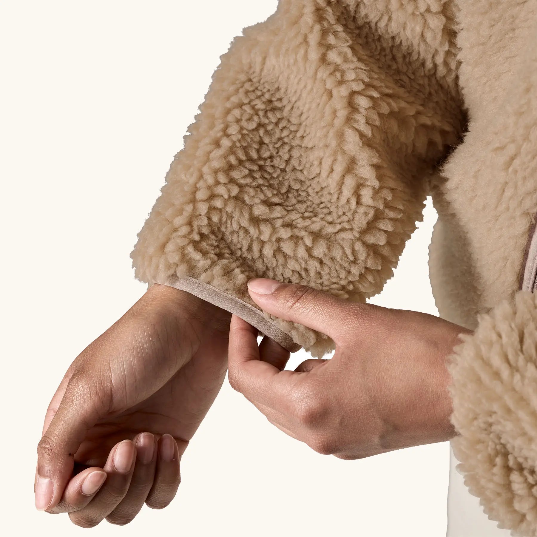 close up of sleeve, tan binding on Patagonia Women's Classic Retro-X® Fleece Jacket in oar tan.