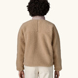 Back of woman wearing Patagonia Women's Classic Retro-X® Fleece Jacket in oar tan.