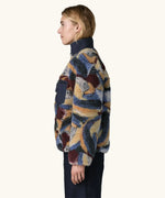 Side view of Woman wearing Patagonia Women's Classic Retro-X® Fleece Jacket in Smudge, Smolder Blue.