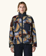 Woman wearing Patagonia Women's Classic Retro-X® Fleece Jacket in Smudge, Smolder Blue. Turn up collar, full length zip, 2 side handwarmer pockets and an easy access chest pocket. 