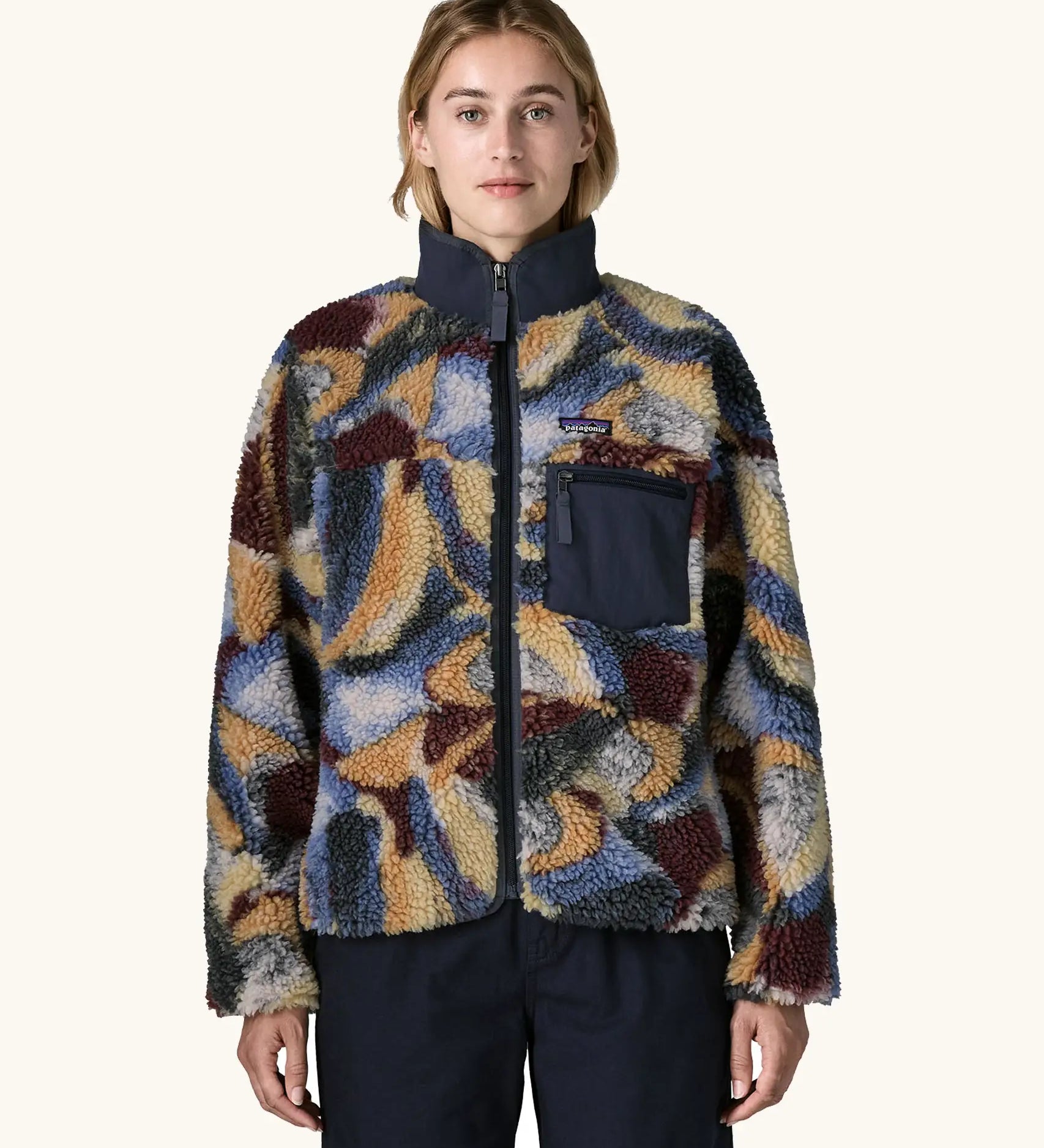 Woman wearing Patagonia Women's Classic Retro-X® Fleece Jacket in Smudge, Smolder Blue. Turn up collar, full length zip, 2 side handwarmer pockets and an easy access chest pocket. 