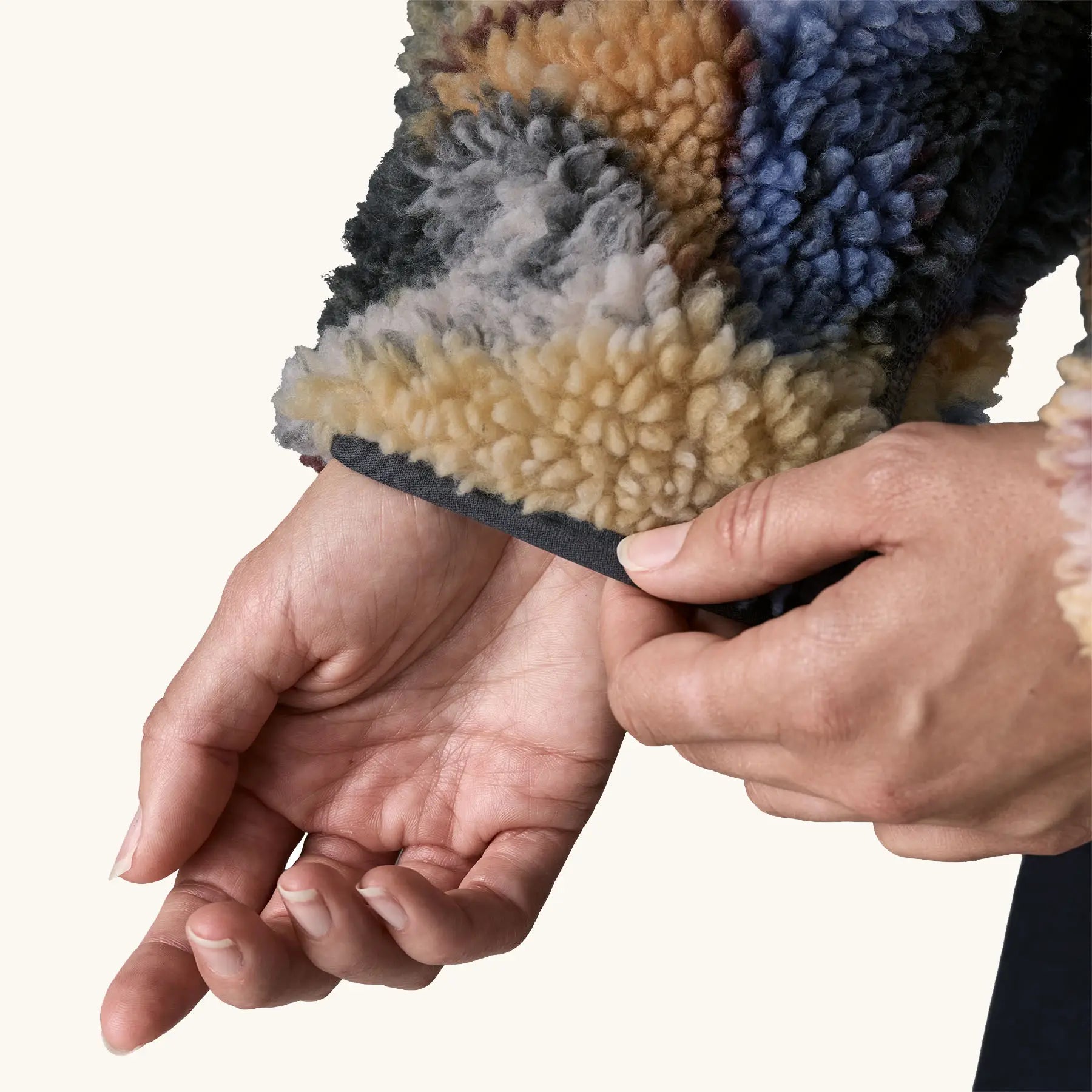 Close up of sleeve of Patagonia Women's Classic Retro-X® Fleece Jacket in Smudge, Smolder Blue. Slate Blue wrist binding visible.