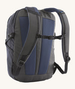 The back of the Patagonia Refugio Day Pack 26L  Smolder Blue, showing the shoulder straps