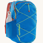 A Patagonia Refugio Day Pack 30L with a water bottle in the side mesh pocket