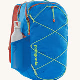 A Patagonia Refugio Day Pack 30L with a water bottle in the side mesh pocket