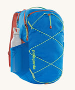 A Patagonia Refugio Day Pack 30L with a water bottle in the side mesh pocket