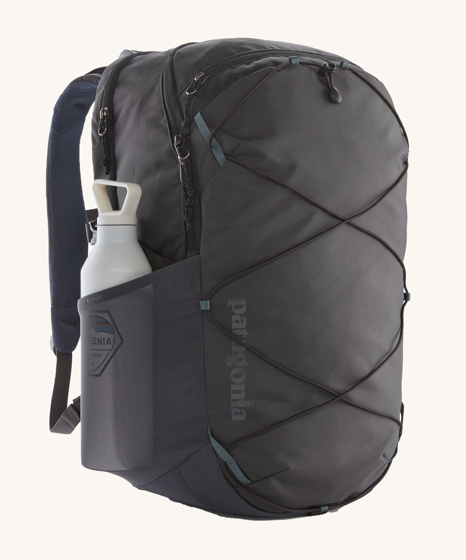 Patagonia Refugio Day Pack 30L  Smolder Blue showing a water bottle in the mesh side pocket