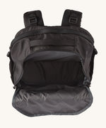 The inside of the Patagonia Refugio Day Pack 30L Black, showing the front pocket open