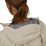 A closer view of the hood on the Patagonia Women's Torrentshell 3L Rain Jacket. The image also shows a person from the back with their hair tied up