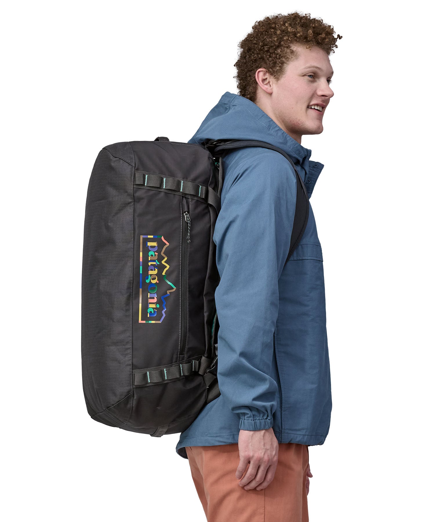 A person wearing the Patagonia Black Hole Duffel 55L Ink Black on the back