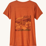 Patagonia Women's Cap Cool Daily Graphic Shirt - Lands Redtail Rust. An orange rust coloured, short sleeve t-shirt with a muted mountain side print