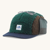 Patagonia Adult Unisex Range Earflap Cap with cascade green and brown fleece and a white logo tag on the front with a denim trim, for sale at Babipur.