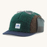 Patagonia Adult Unisex Range Earflap Cap with cascade green and brown fleece and a white logo tag on the front with a denim trim, for sale at Babipur.