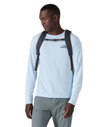 A person wearing the Patagonia Refugio Day Pack 30L  Smolder Blue