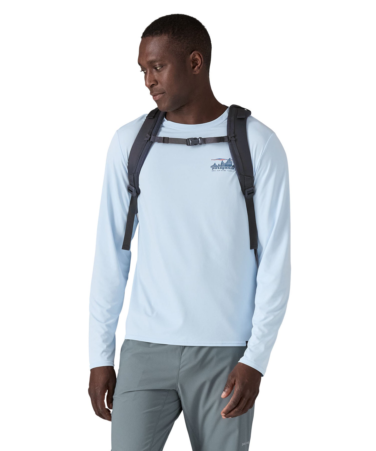 A person wearing the Patagonia Refugio Day Pack 30L  Smolder Blue