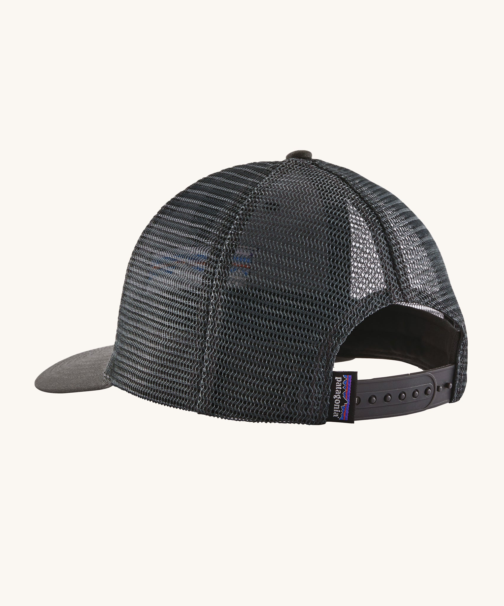 The back of the Patagonia P-6 Logo Trucker Hat - Forge Grey, showing the adjustable strap and mesh on the back of the hat