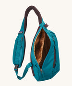 The Patagonia Atom Sling 8L open and showing the inside compartments