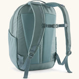 Patagonia atom 24 litre day pack in sage blue with matching shoulder straps and quick release buckle 