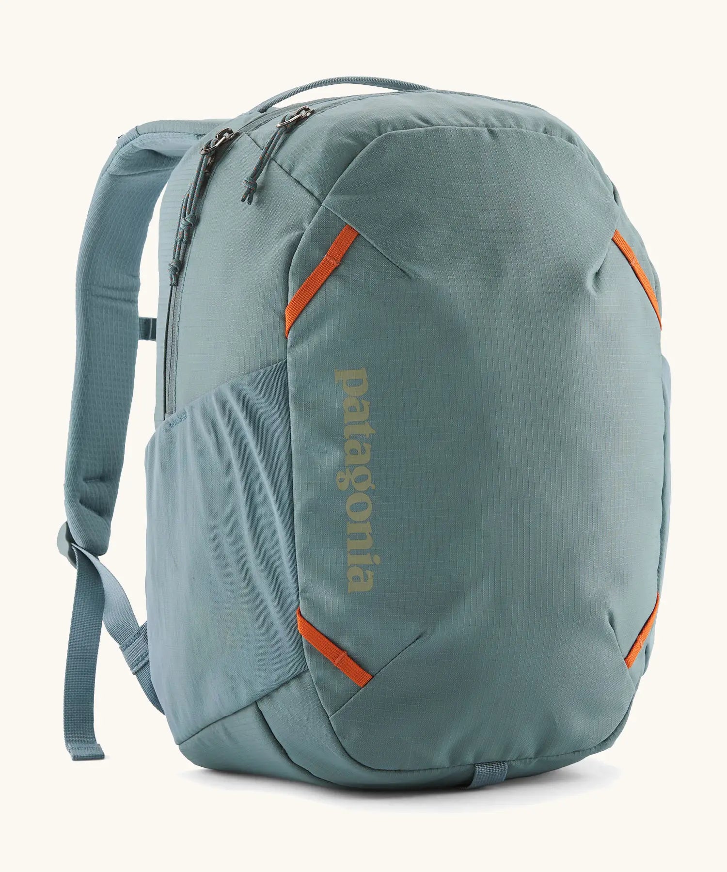 Patagonia atom 24 litre day pack in sage blue with matching shoulder straps zipped compartment and side pocket