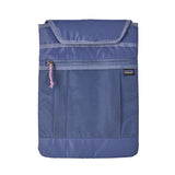 A close up of the laptop sleeve attachment for the Patagonia current blue atom day pack available at Babipur. Features a velcro fastener and a extra zip pocket on the front.
