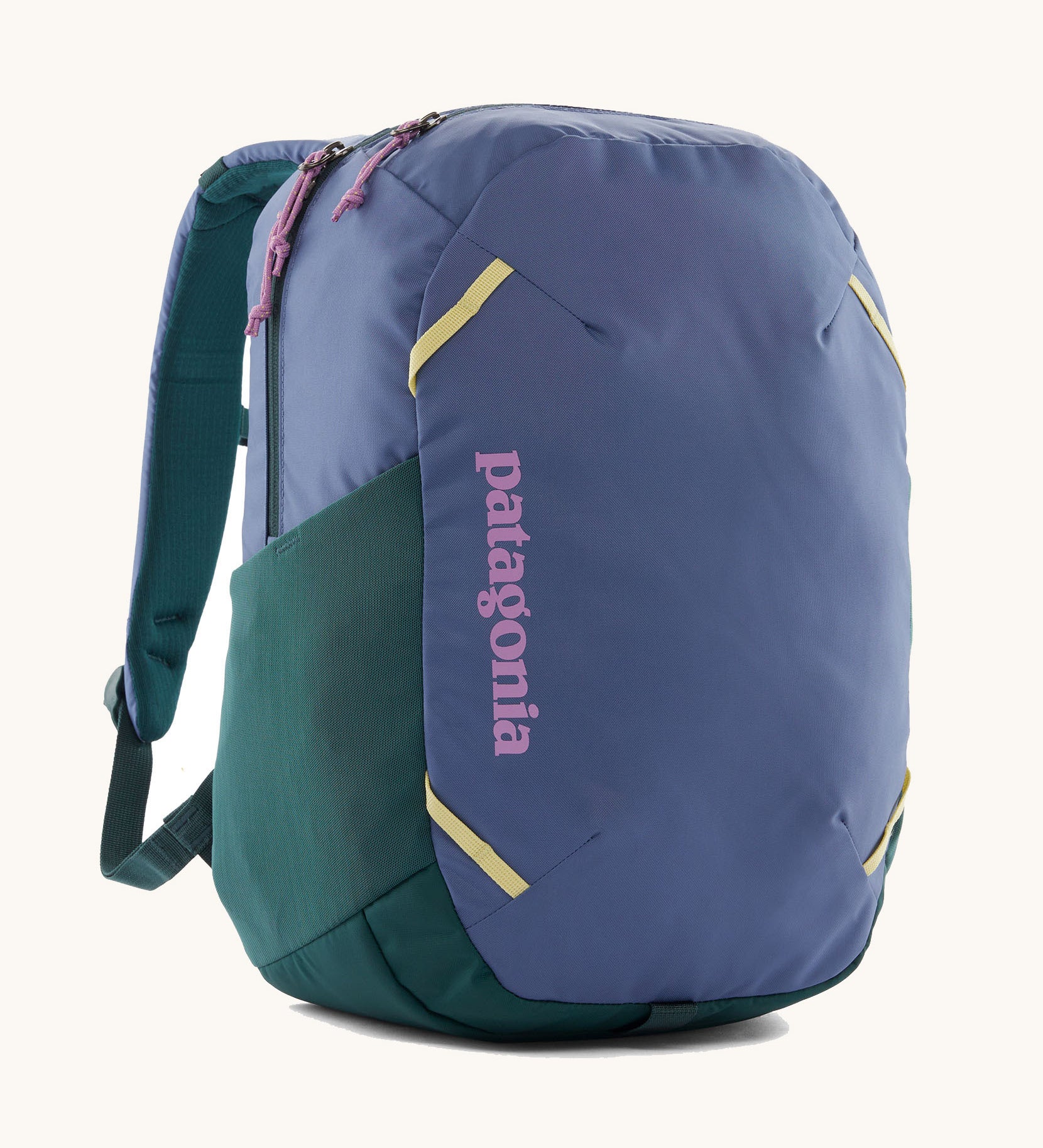 Patagonia atom 24 litres day pack in current blue. A 100% recycled material backpack in blue with dark green, pink and yellow detail. Features padded shoulder pads, mesh side pockets and 2 main compartments. 