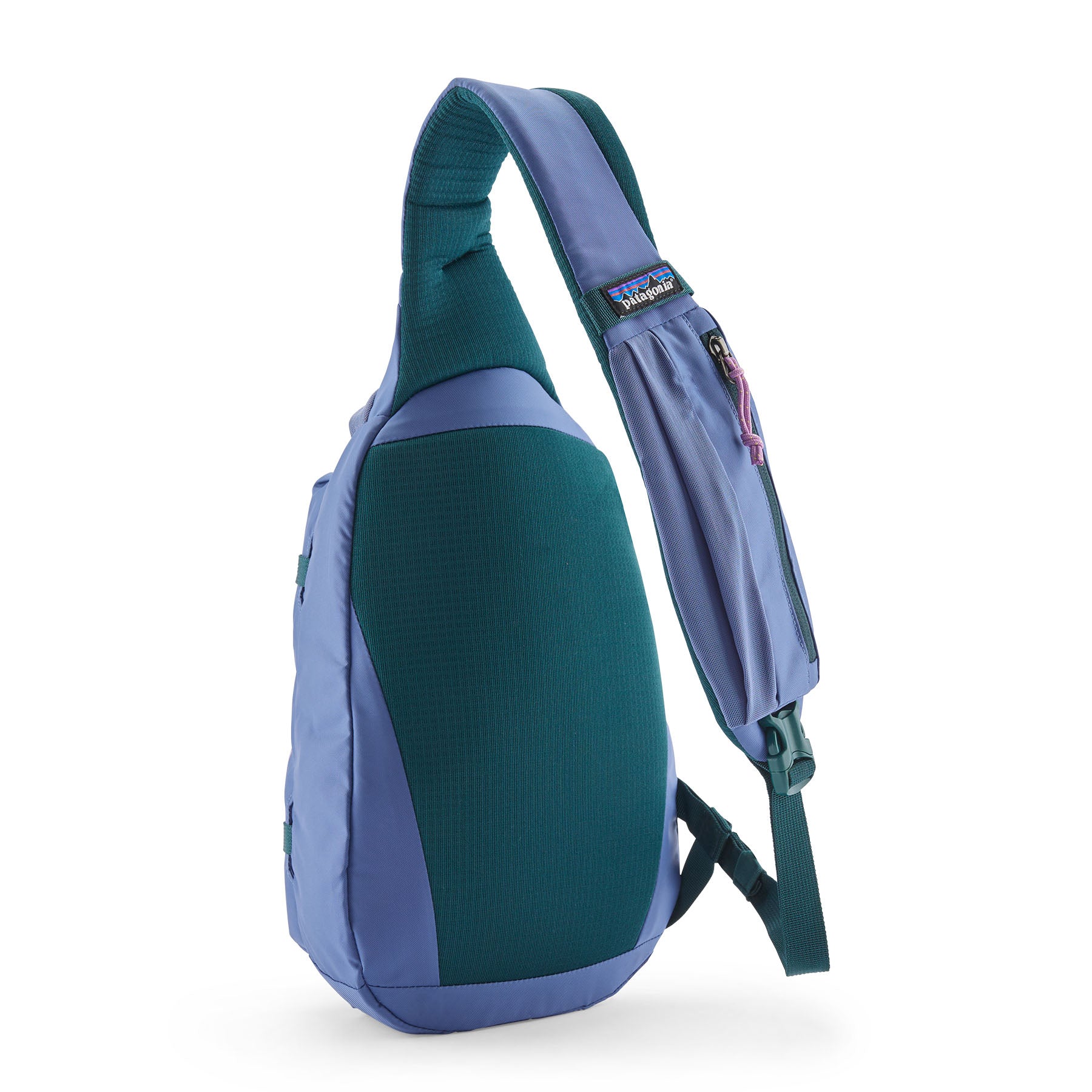 The Patagonia atom 8 litre sling bag in current blue available at Babipur showing the padded shoulder strap and back panel detail with green trim
