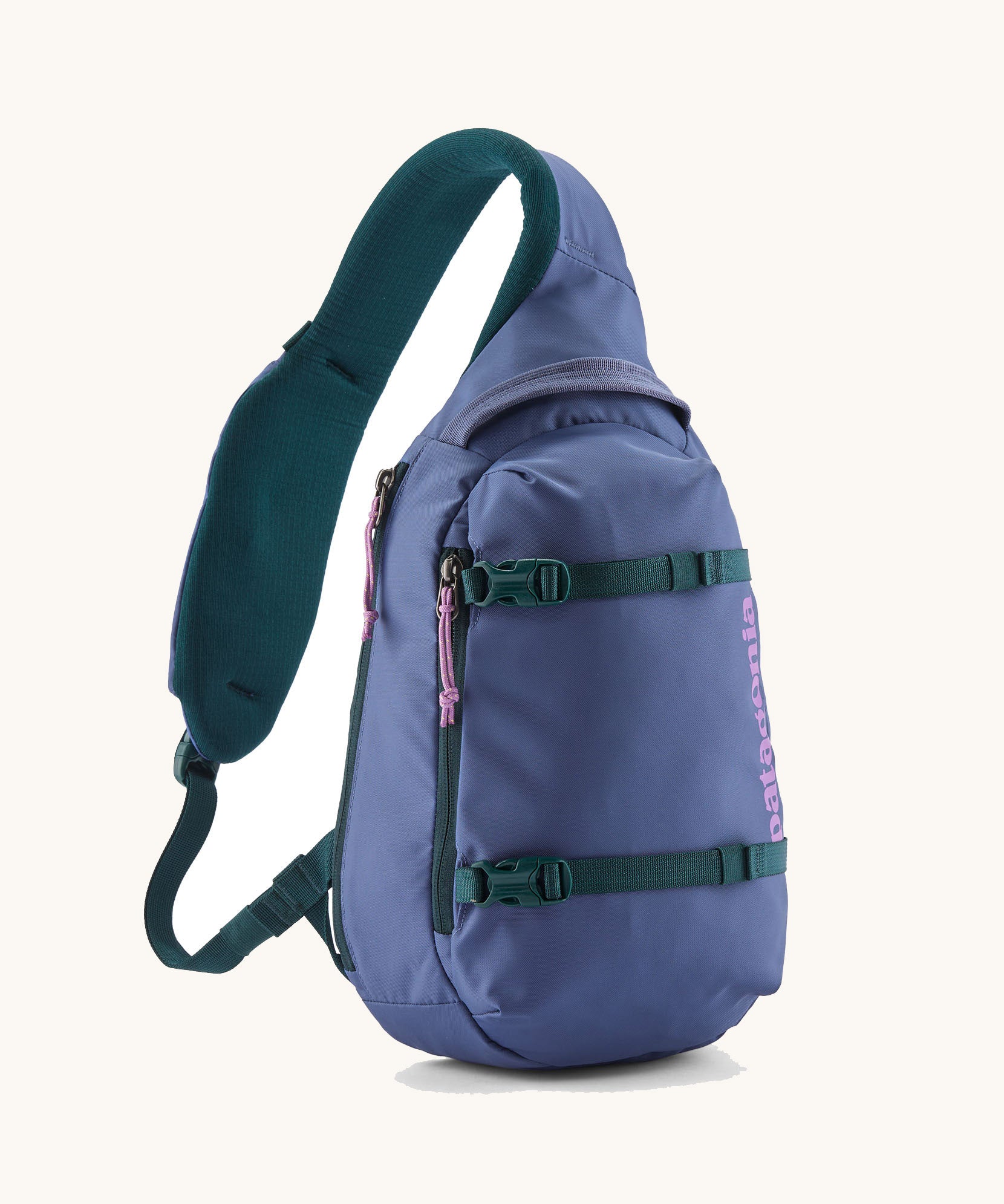 Patagonia atom 8 litre sling bag in currentl blue. A 100% recycled material bag in blue with dark green detail. Features a padded shoulder strap. 2 main compartments and buckle fasteners to keep contents secure. 