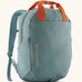 Patagonia atom 20 litre tote pack in sage blue with orange top handle zipped compartment and side pocket