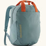 Patagonia atom 20 litre tote pack in sage blue with orange top handle zipped compartment and side pocket