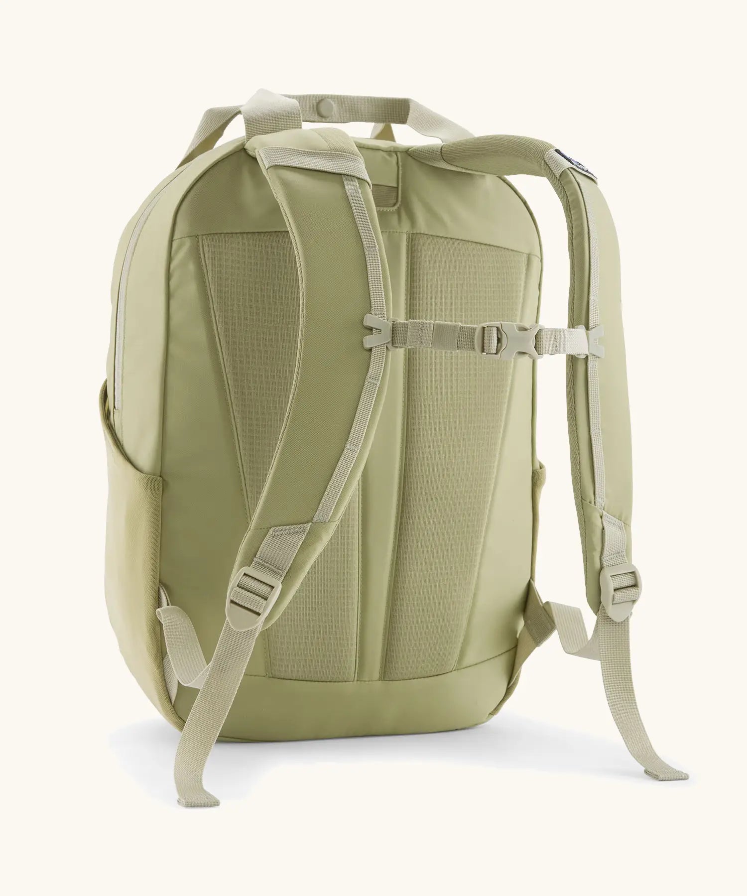 Patagonia atom 20 litre tote pack in light green with matching shoulders straps and quick release buckle