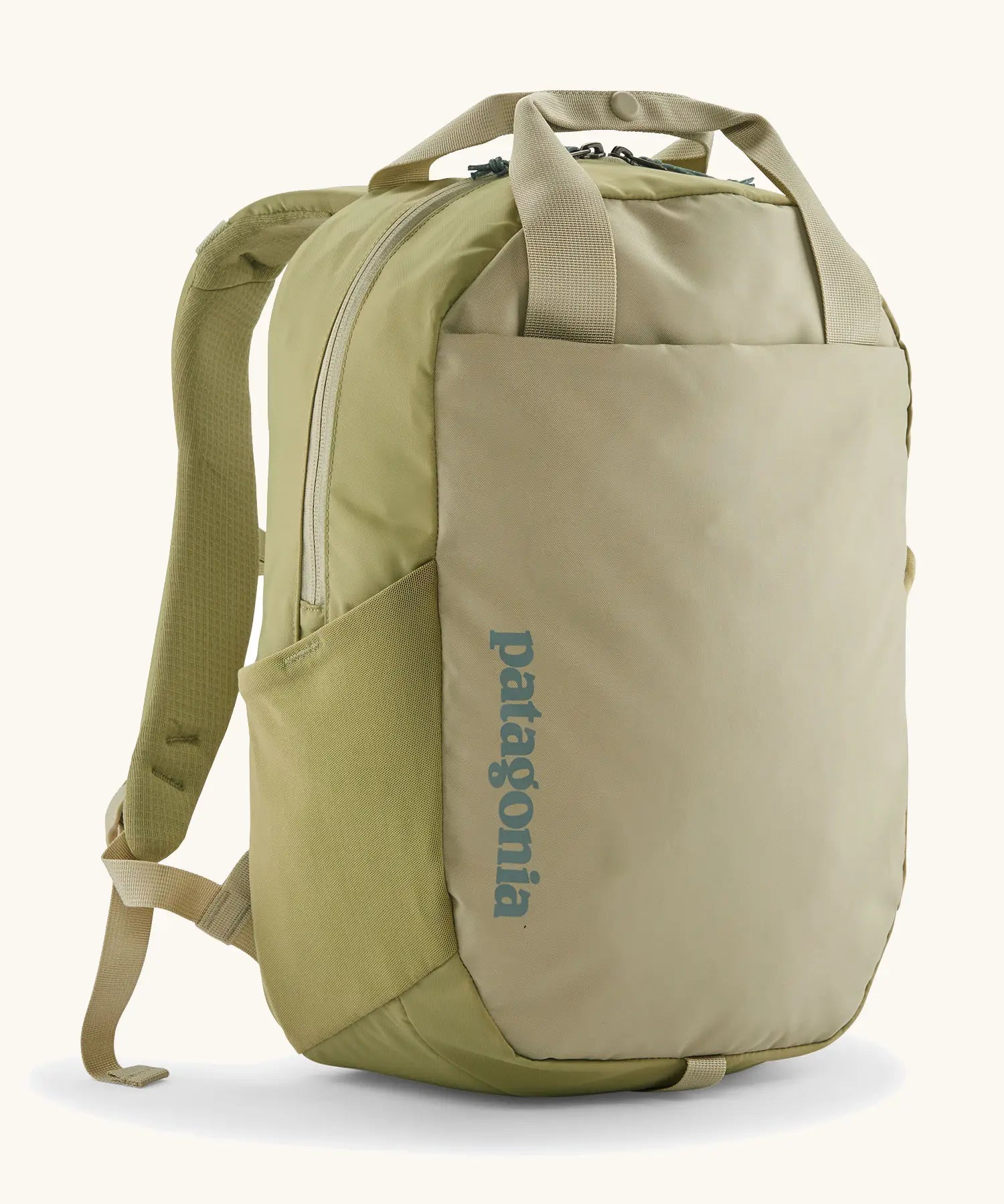 Patagonia atom 20 litre tote pack in light green with matching top handle, zipped compartment and side pocket