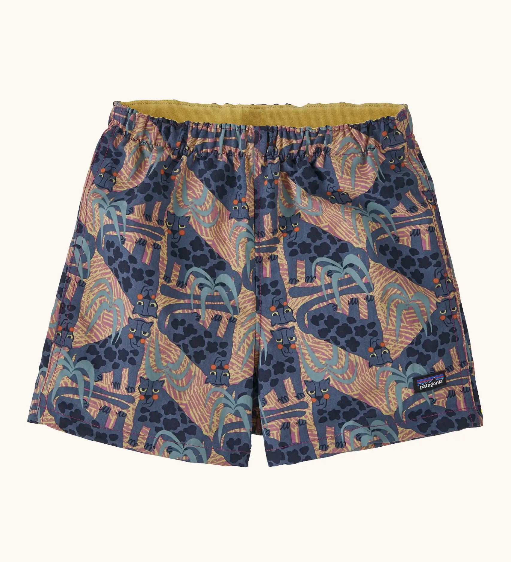 Patagonia baby baggies quick drying shorts in blue with repeating abstract and lion design. Shows elasticated waist band