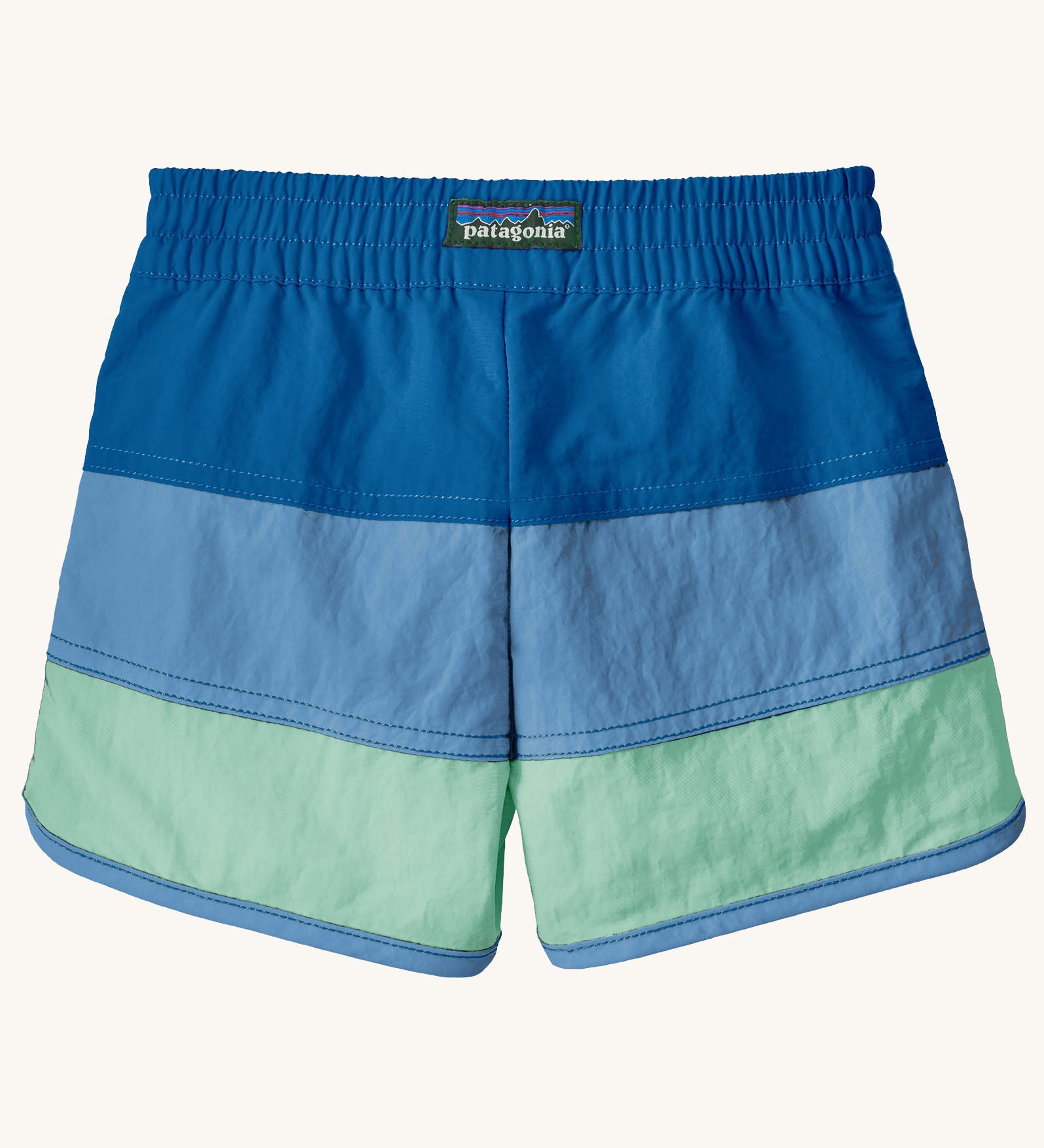 Back of Patagonia's baby quick drying boardshorts in a blue striped design. Shows elastic waistband 