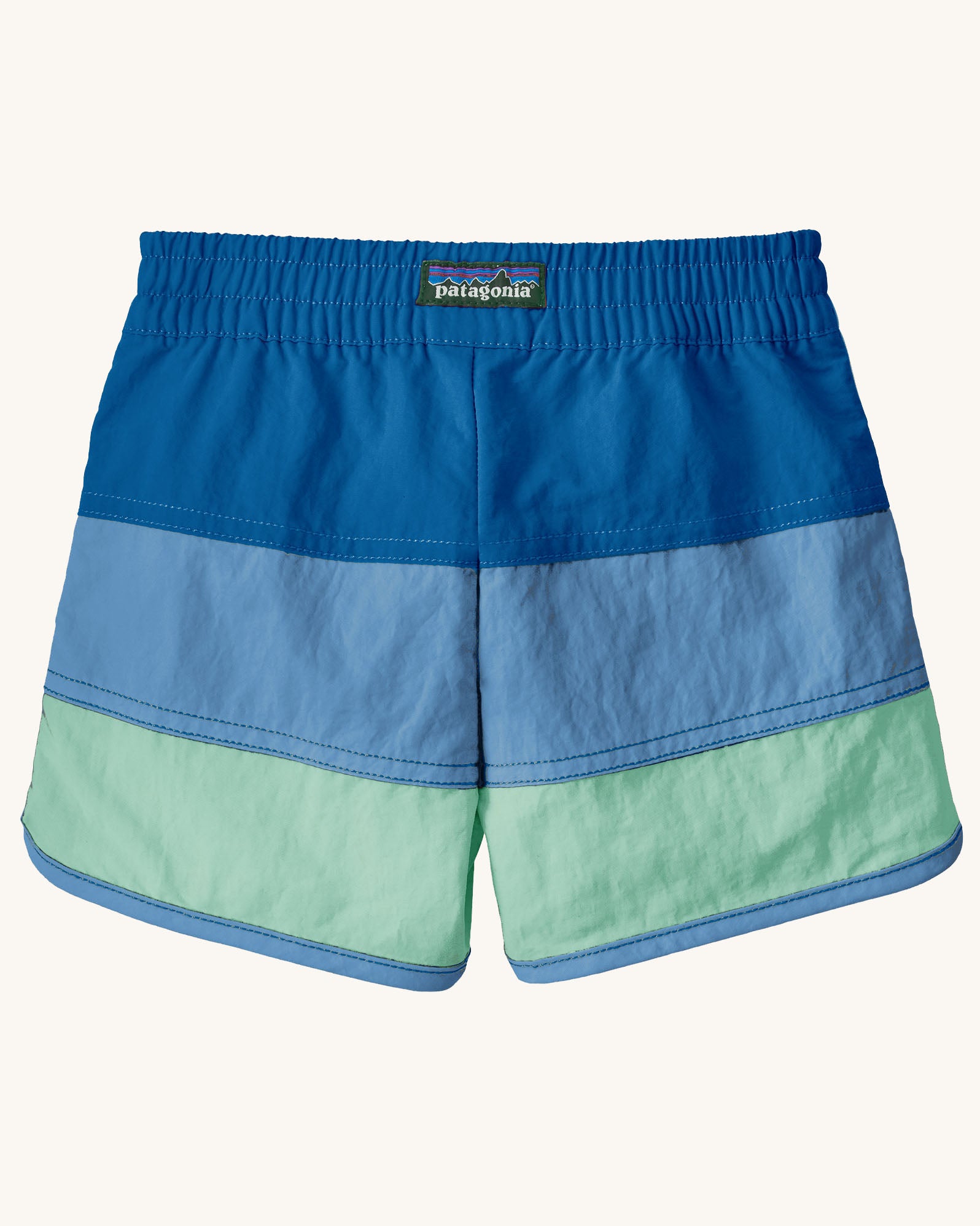 Back of Patagonia's baby quick drying boardshorts in a blue striped design. Shows elastic waistband 