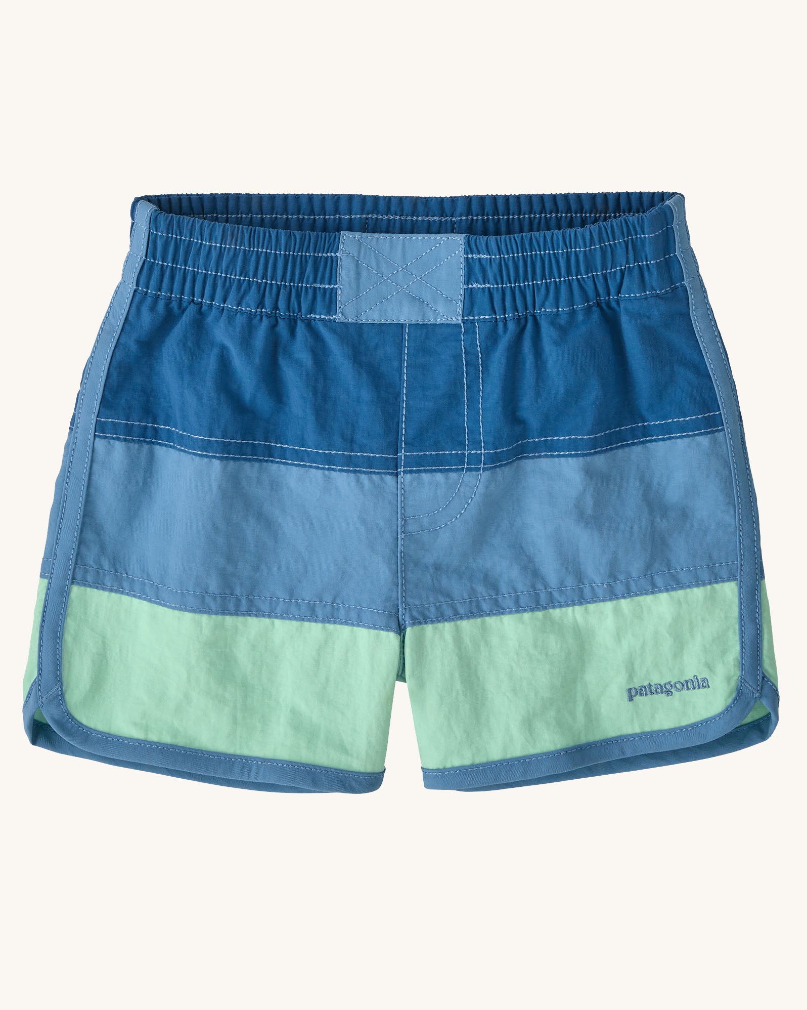 Patagonia's baby quick drying boardshorts in a blue striped design. Shows elastic waistband 