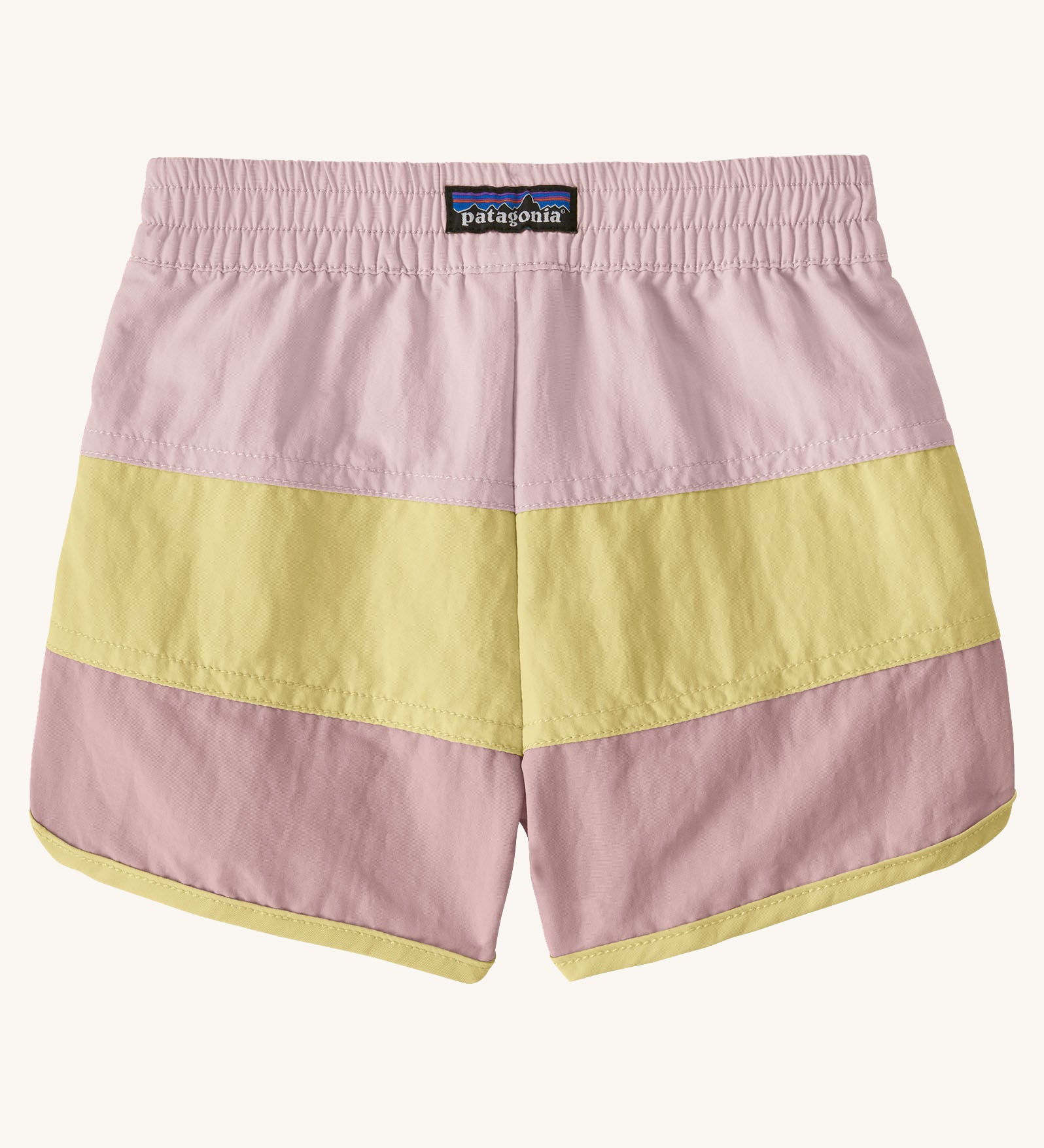 Back of Patagonia's baby quick drying boardshorts in a pink and yellow stripe design. Shows elastic waistband 