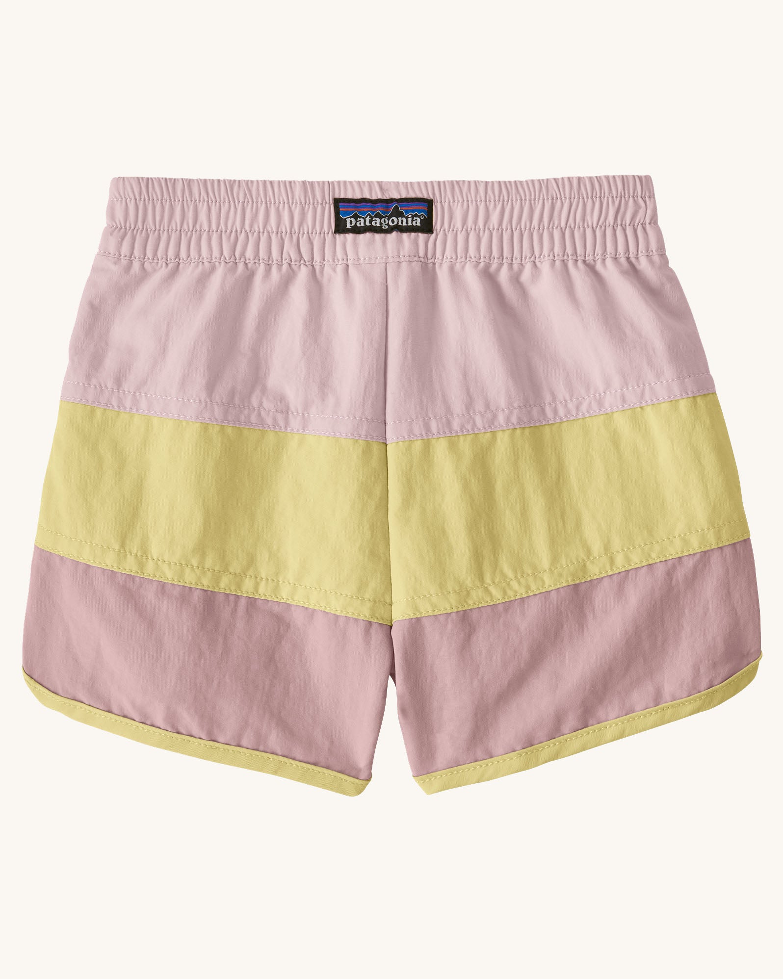 Back of Patagonia's baby quick drying boardshorts in a pink and yellow stripe design. Shows elastic waistband 