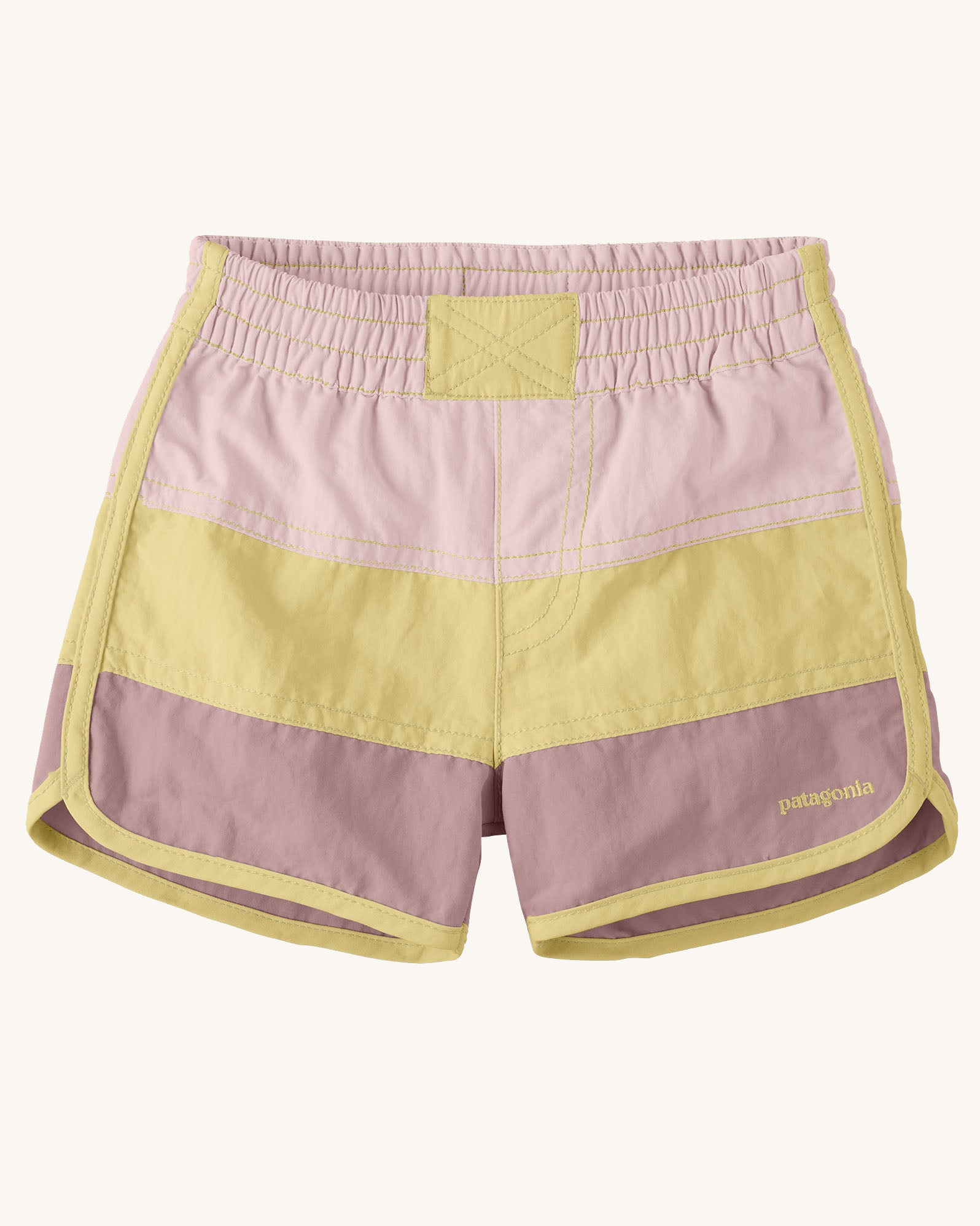Patagonia's baby quick drying boardshorts in a pink and yellow stripe design. Shows elastic waistband 